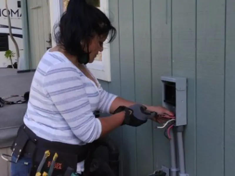 Licensed electrician wiring an exterior subpanel in McGehee